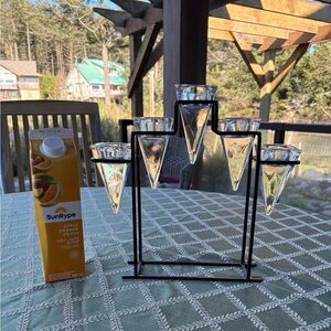 Candle holder with five triangular square glass votive holders